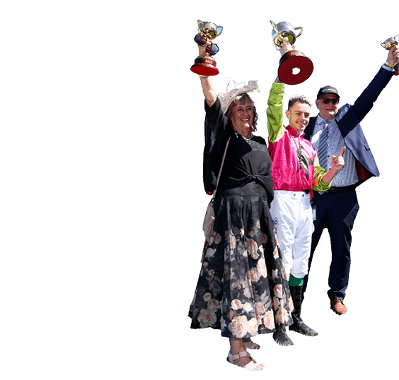 MELBOURNE, AUSTRALIA - NOVEMBER 05: Robbie Dolan poses with trainers Sheila Laxon and John Symons and the cups after Knight's Choice won Race 7, the Lexus Melbourne Cup - Betting Odds during Melbourne Cup Day at Flemington Racecourse on November 05, 2024 in Melbourne, Australia. (Photo by Josh Chadwick/Getty Images)