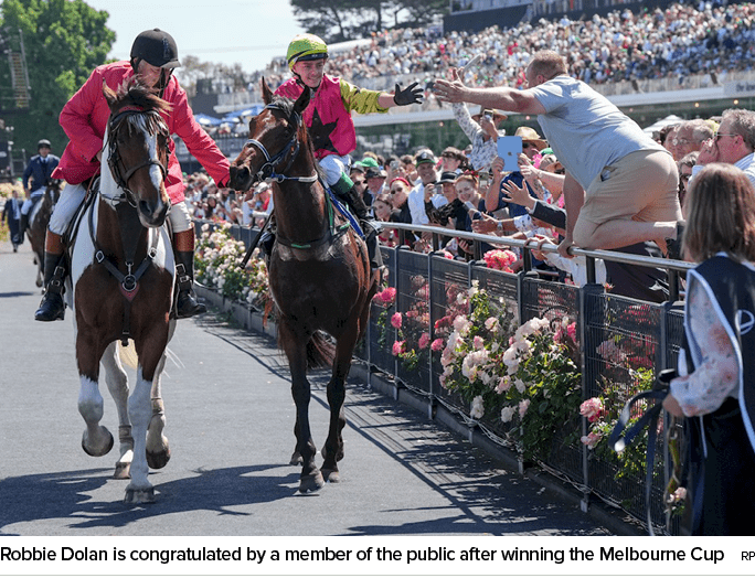 Robbie Dolan is congratulated by a member of the public after winning the Melbourne Cup R